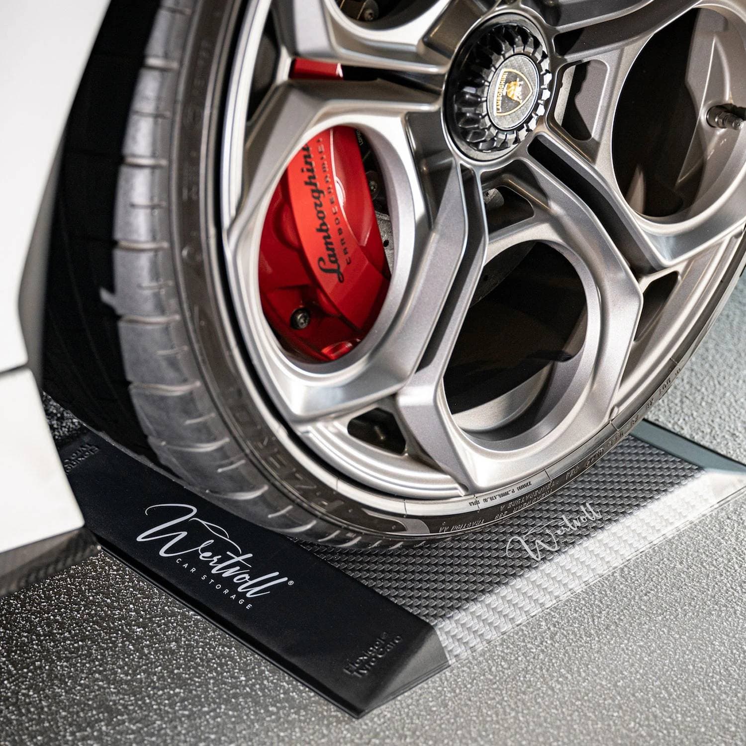 FlexiGel Sport cradle under a sports car wheel with red brake calipers